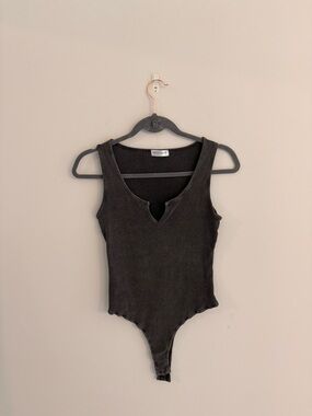 vestique Black Notch-Neck Ribbed Kids Bodysuit